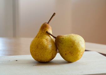 two pears on a wooden table