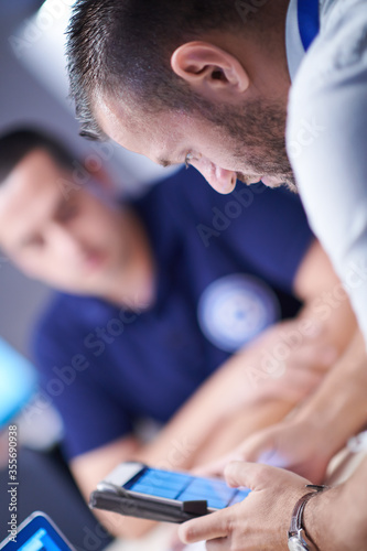 Fotomural Group of security guards sitting and having briefing