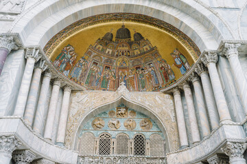 Wall Mural - Venice, Italy- Detail of the mosaics at the entrance of the basilica of San Marco