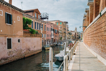 Wall Mural - Venice, Italy - May 30, 2020: Canal and deserted calle at the time of Covid 19 - Coronavirus