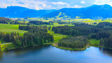 Fototapeta Krajobraz - Flight over the beautiful rural landscape of Bavaria Allgau in the German Alps. Aerial view