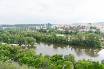 view of green and railway tracks and old tunnel in prague city