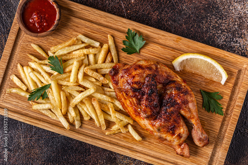Fotografía Half Roasted Chicken Piri Piri with French Fries