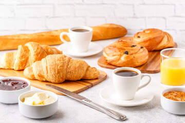 Breakfast with coffee and croissants