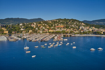 Canvas Print - Panoramic aerial view of the bay of the tourist city of Rapallo, Genoa, Italy. Boat parking, resorts in Italy. Aerial photography with drone.