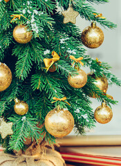 Wall Mural - Green fir tree with golden balls. Christmas wallpaper.