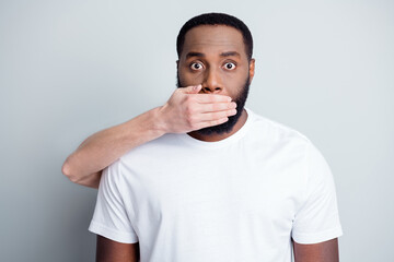 Wall Mural - Shut up. Photo of helpless african american guy unfairly society black race citizens white skin arm close his mouth threatening danger lawlessness iniquity isolated grey color background