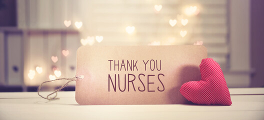 Wall Mural - Thank You Nurses message with a red heart with heart shaped lights