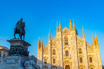 Duomo cathedral in Milano viewed behind statue of king Vittorio Emanuele II