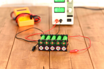 Li ion battery on the wooden table.