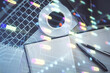 © peshkova - Multi exposure of data theme drawing hologram over topview work desk background with computer. Concept of technology.