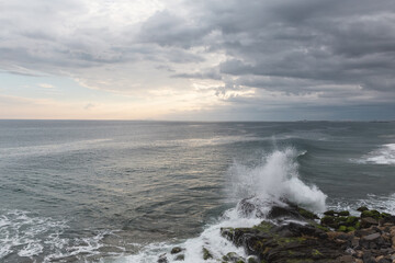 Wall Mural - waves crashing on rocks