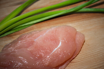 Wall Mural - Chicken fillet with vegetables on a cutting board