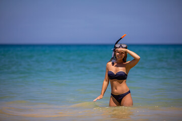 Young beautiful girl in a mask for diving