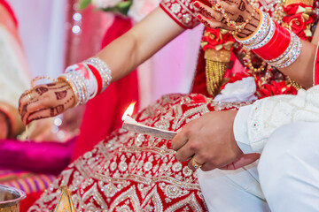 Indian Hindu wedding ceremony and pooja ritual items, hands, and decorations close ups