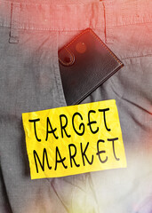Poster - Word writing text Target Market. Business photo showcasing specific costumers to whom a company aims its marketing Small little wallet inside man trousers front pocket near notation paper