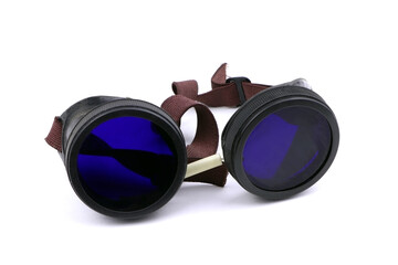 Old welding glasses isolated on a white background. A protective glasses. Goggles for welding