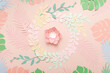 © uv_group - Flat lay of paper flowers on pastel pink background. Summer fashion and trendy frame