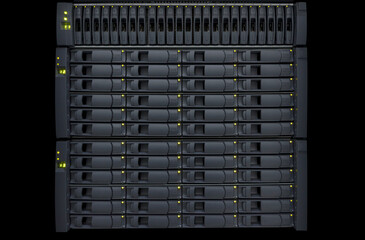 Disk storage in data center room close-up of hard disk drives. Network attached storage (NAS) in server rack.