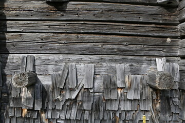 old wooden facade of old house in alps