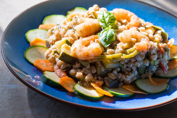 Wall Mural - spelled salad with vegetables and prawns