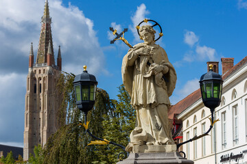 Statue of St.John of Nepomuk, on Wollestraat Bridge in Bruges, Belgium