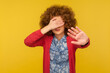 © khosrork - No, don't want to look. Portrait of scared woman with curly hair covering eyes and showing stop gesture, feeling shy afraid to watch, ignoring troubles. studio shot isolated on yellow background