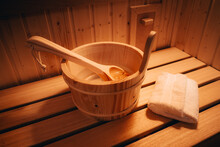 Private Wooden Sauna With Folded Towels, Wooden Bucket And A Wooden Spoon. 