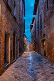 Fototapeta Uliczki - narrow street in the old town in Tuscany