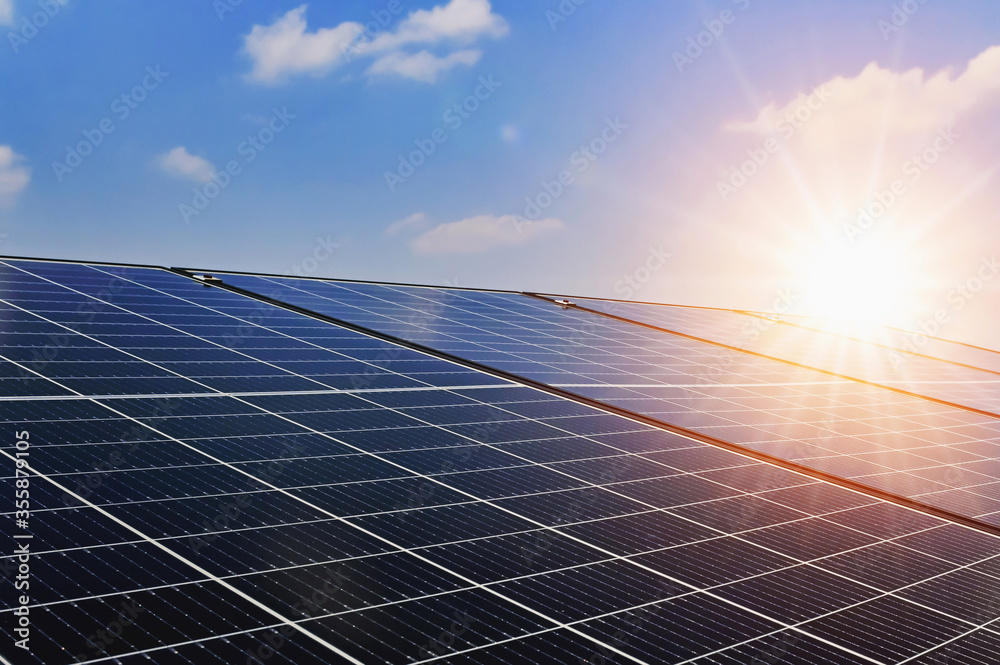 Solar panels with sunset and blue sky background. Clean power energy concept. - obrazy, fototapety, plakaty 