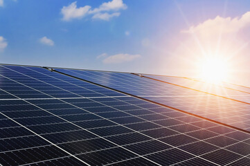 Wall Mural - solar panels with sunset and blue sky background. clean power energy concept.