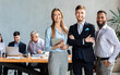 © Prostock-studio - Three Business Partners Standing Smiling To Camera In Modern Office