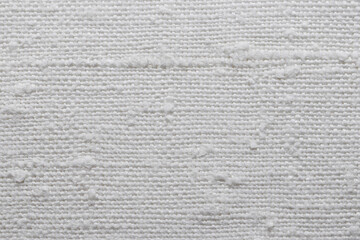 Wall Mural - Texture of an old natural linen fabric with many defects. White textile material for background. Closeup
