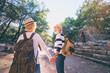 © Loginova - Travel and tourism. Senior family couple walking together on ancient sightseeing.