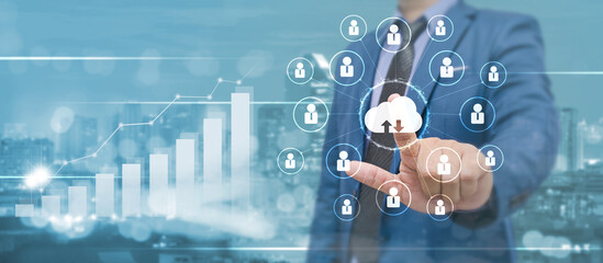 businessman hand point on cloud technology with connected people network and growth busines graph ba