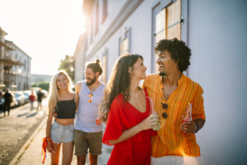 Wall Mural - Group of young friends having fun together outdoor