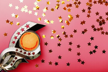 Superprize of gold with fireworks of stars on a red background.