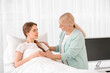 © Pixel-Shot - Mother visiting her daughter in hospital