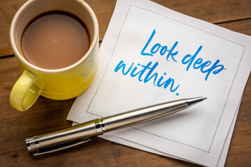 Wall Mural - look deep within inspirational and spiritual handwriting on a napkin with a cup of coffee