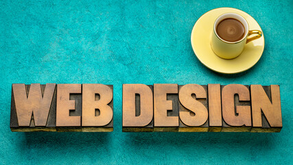 Wall Mural - web design word abstract in vintage letterpress wood type with coffee against textured handmade pape