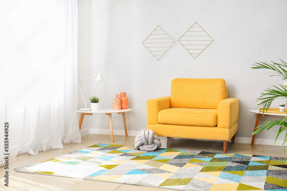 Interior of modern living room with comfortable armchair