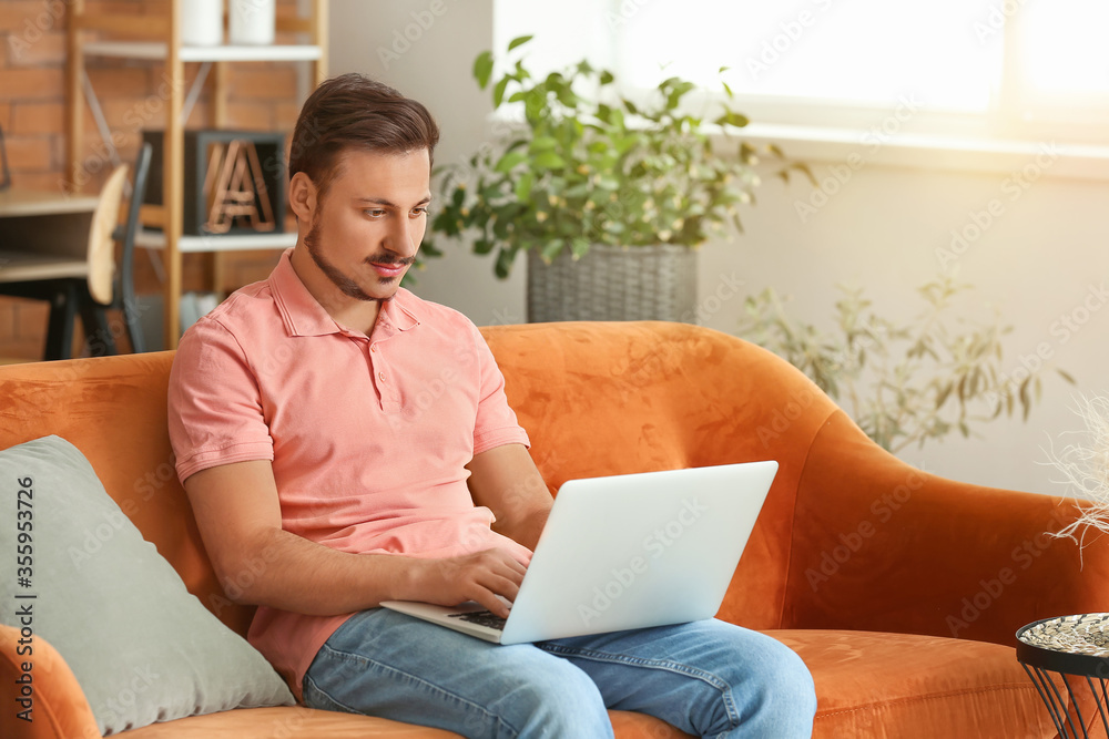 Young male freelancer working at home
