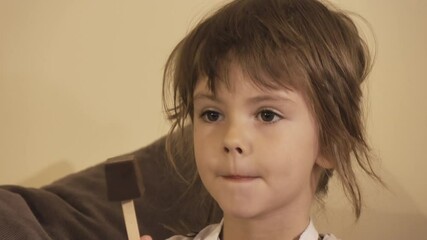 charming little girl making biscuits at the kitchen table