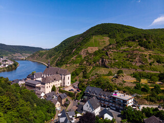 With the bike on the cycle path through the countryside along the river Moselle in Rhineland-Palatinate from Trier to Koblenz in summer