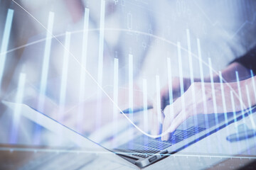 Poster - Double exposure of woman hands typing on computer and forex chart hologram drawing. Stock market invest concept.