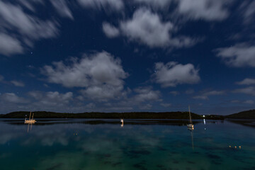 Wall Mural - Harbour starry night landscape in Tonga.