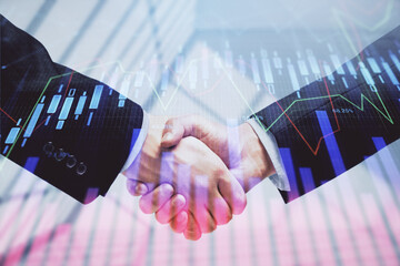 Double exposure of forex graph hologram and handshake of two men. Stock market concept.