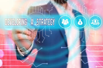 Poster - Text sign showing Developing A Strategy. Business photo showcasing Discussing the Ideas for New Goal Marketing Vision Planning Business