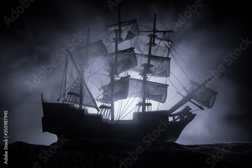 Fotomural Black silhouette of the pirate ship in night