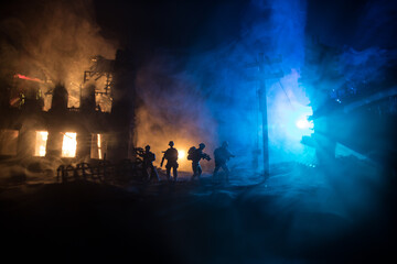 War Concept. Military silhouettes fighting scene on war fog sky background, World War Soldiers Silhouette Below Cloudy Skyline At night.